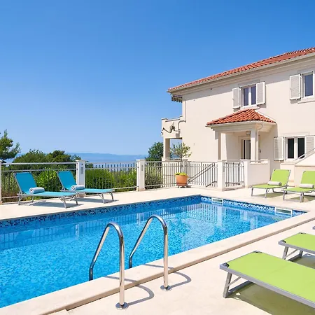 With Two Separate Four-bed Apartments, Private Pool, Grill And Garage